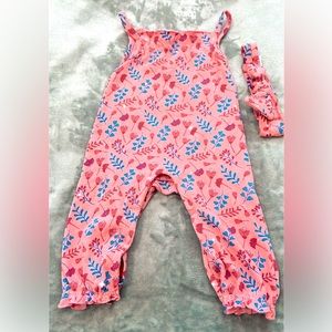 One piece infant pink jumper with matching headband.